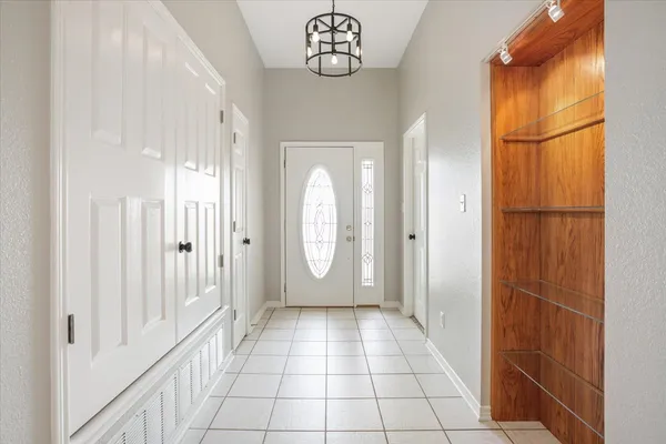 a view of a entrance to room with wooden floor