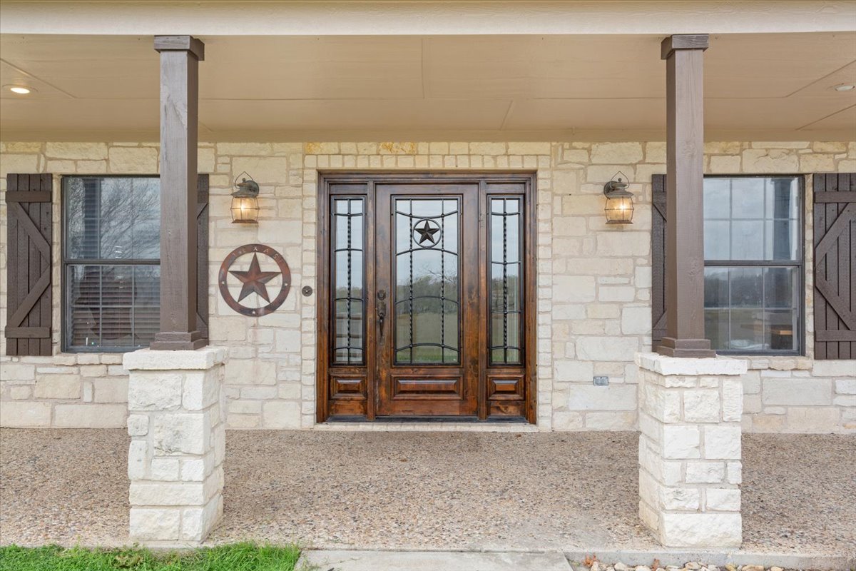 8600 Five Wells Road Rogers, TX 76569 - Photo 3 of 40 a front view of a building with shower