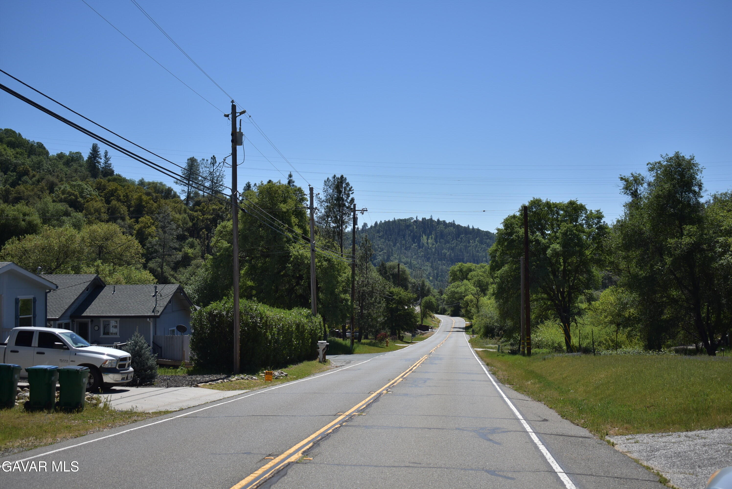 15788 Brewer Road Grass Valley, CA 95949 - Photo 16 of 18 a view of a street with a building and a street sign