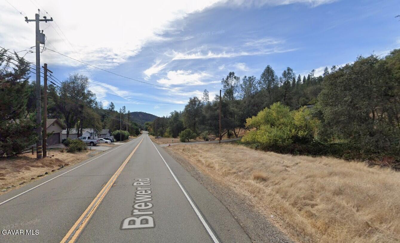 15788 Brewer Road Grass Valley, CA 95949 - Photo 6 of 13 a view of a street with a building in the background