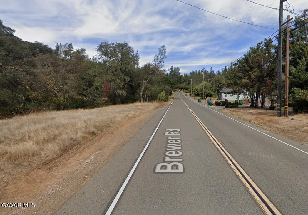 15788 Brewer Road Grass Valley, CA 95949 - Photo 7 of 13 a view of a street with a building in the background