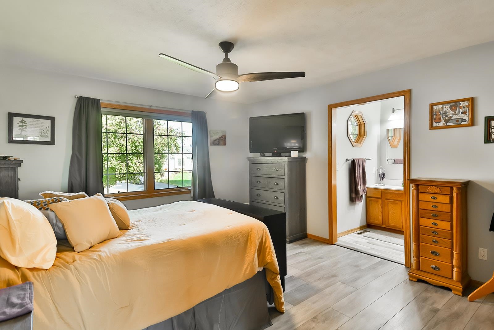 245 Rochester Road Northeast Poplar Grove, IL 61065 - Photo 12 of 29 a bedroom with a bed and wooden floor