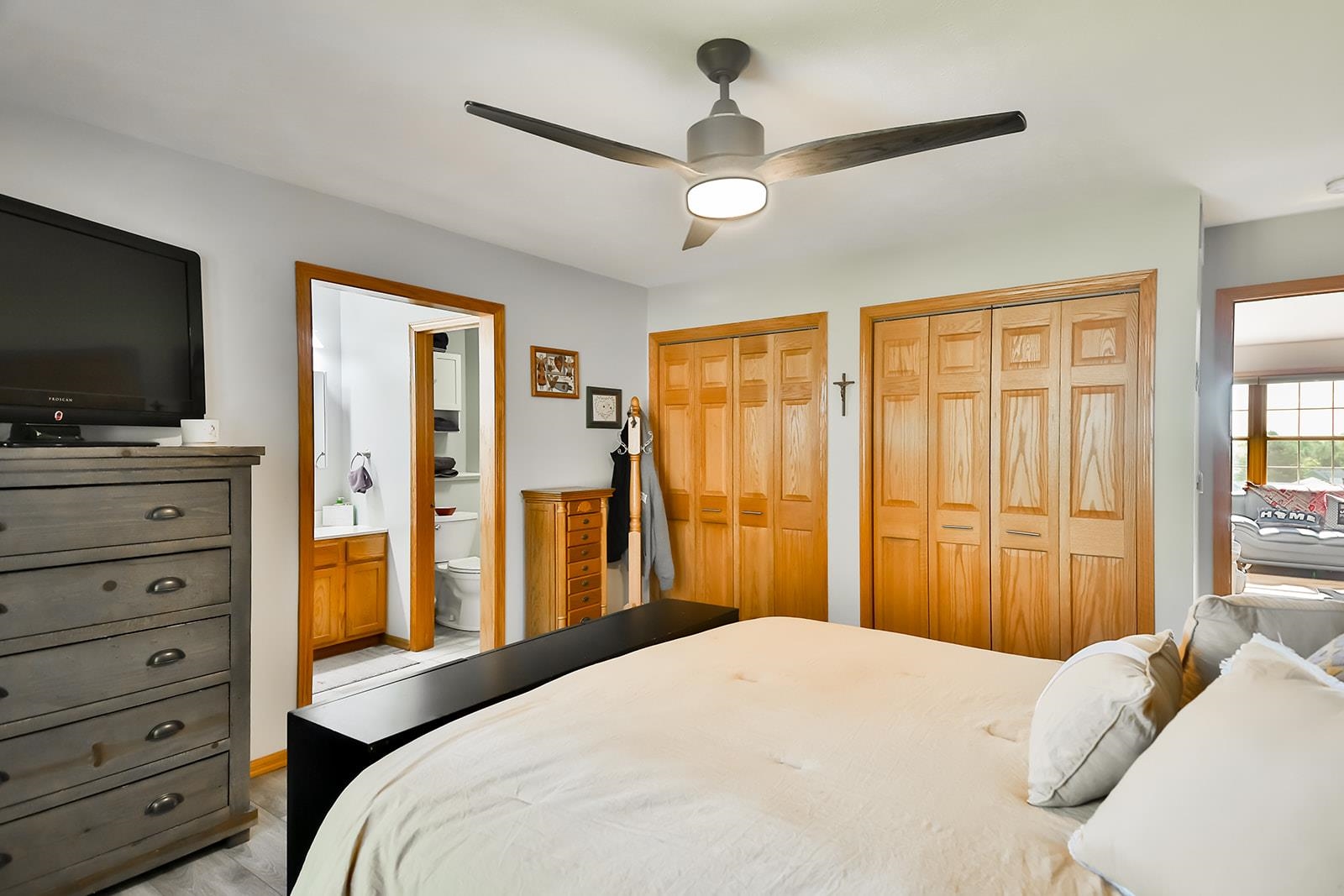 245 Rochester Road Northeast Poplar Grove, IL 61065 - Photo 14 of 29 a bedroom with a bed and a flat tv screen on dresser