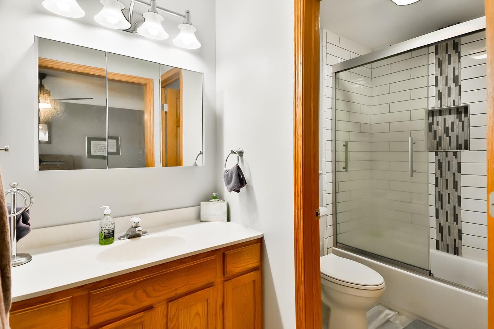 245 Rochester Road Northeast Poplar Grove, IL 61065 - Photo 15 of 29 a bathroom with a granite countertop sink toilet and shower