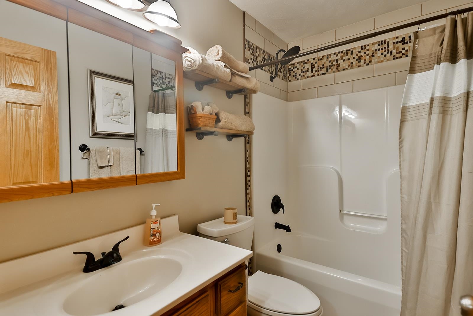 245 Rochester Road Northeast Poplar Grove, IL 61065 - Photo 16 of 29 a bathroom with a sink toilet and shower