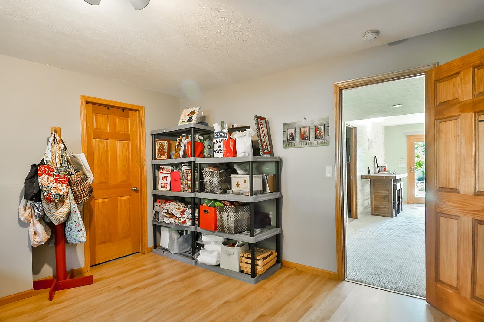 245 Rochester Road Northeast Poplar Grove, IL 61065 - Photo 22 of 29 a room with furniture and a book shelf