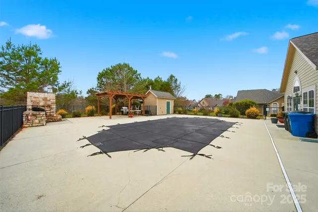 a view of a patio with a table and chairs