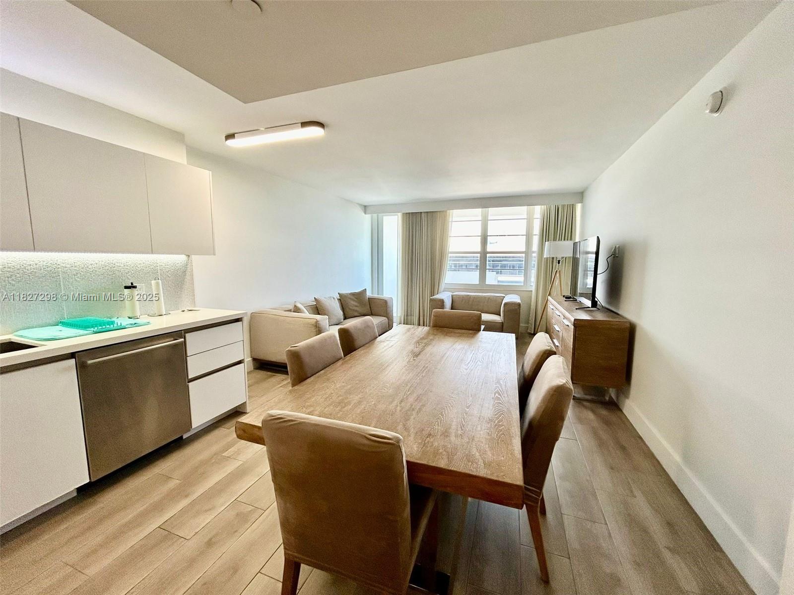 100 Lincoln Road, Unit 1429 Miami Beach, FL 33139 - Photo 2 of 13 a view of a dining room with furniture and wooden floor