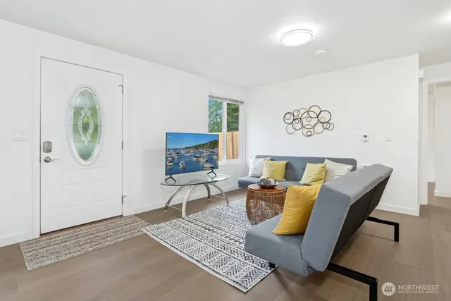 a living room with furniture and a rug