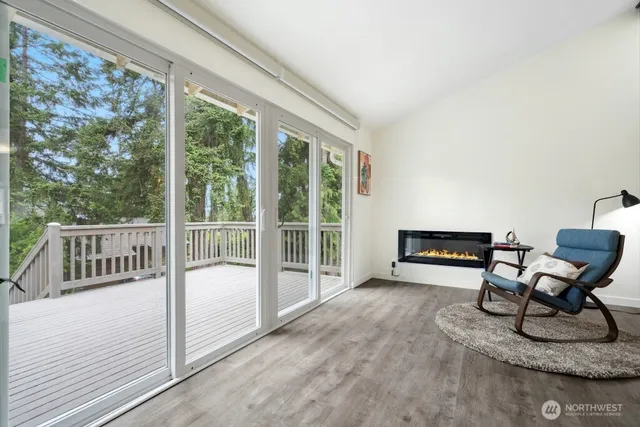 a view of a room with furniture and floor to ceiling window