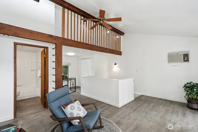 a view of a hallway with seating area