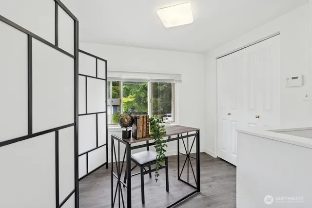 a view of a room with furniture and window