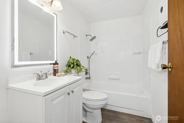 a bathroom with a sink a toilet and a bathtub
