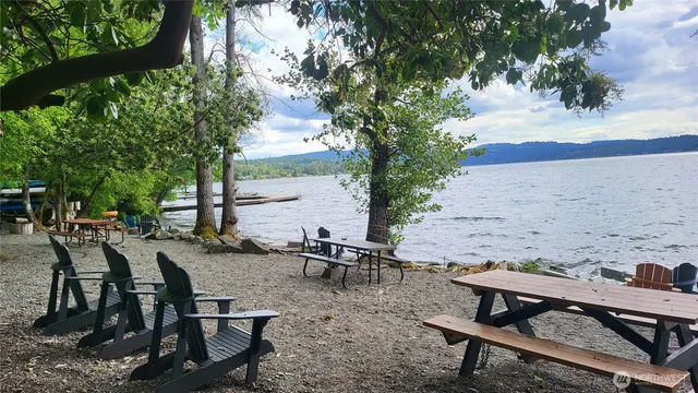 a view of a backyard with sitting area