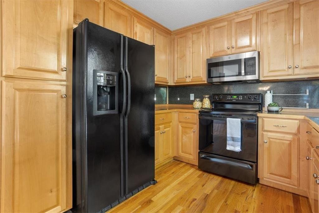 12 Moorings Run Jasper, GA 30143 - Photo 12 of 54 a kitchen with stainless steel appliances granite countertop a refrigerator stove and sink