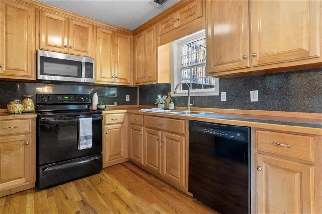 12 Moorings Run Jasper, GA 30143 - Photo 13 of 54 a kitchen with granite countertop cabinets stainless steel appliances and a sink