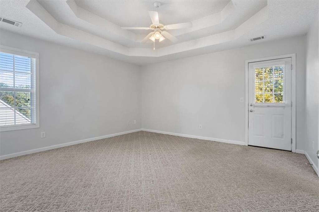 12 Moorings Run Jasper, GA 30143 - Photo 15 of 54 an empty room with a window and a ceiling fan