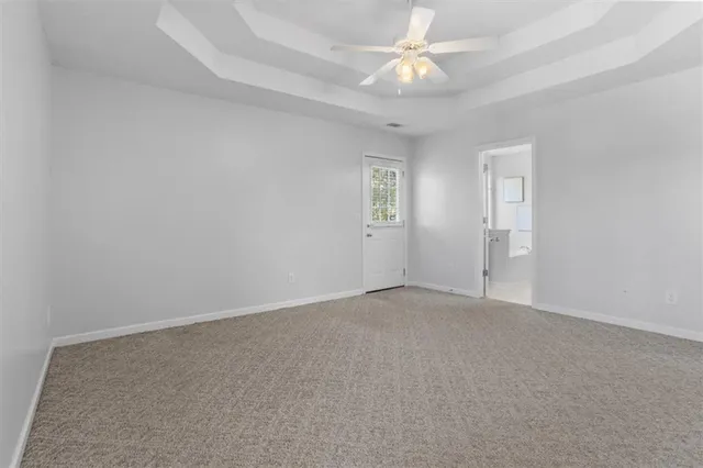 a balcony with wooden floor and outdoor seating