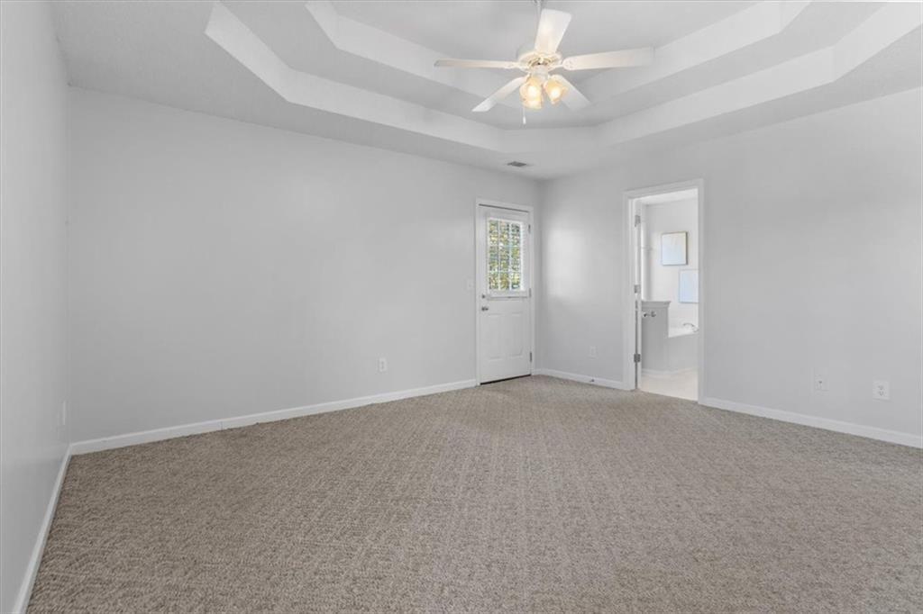 12 Moorings Run Jasper, GA 30143 - Photo 16 of 54 an empty room with a chandelier fan and windows