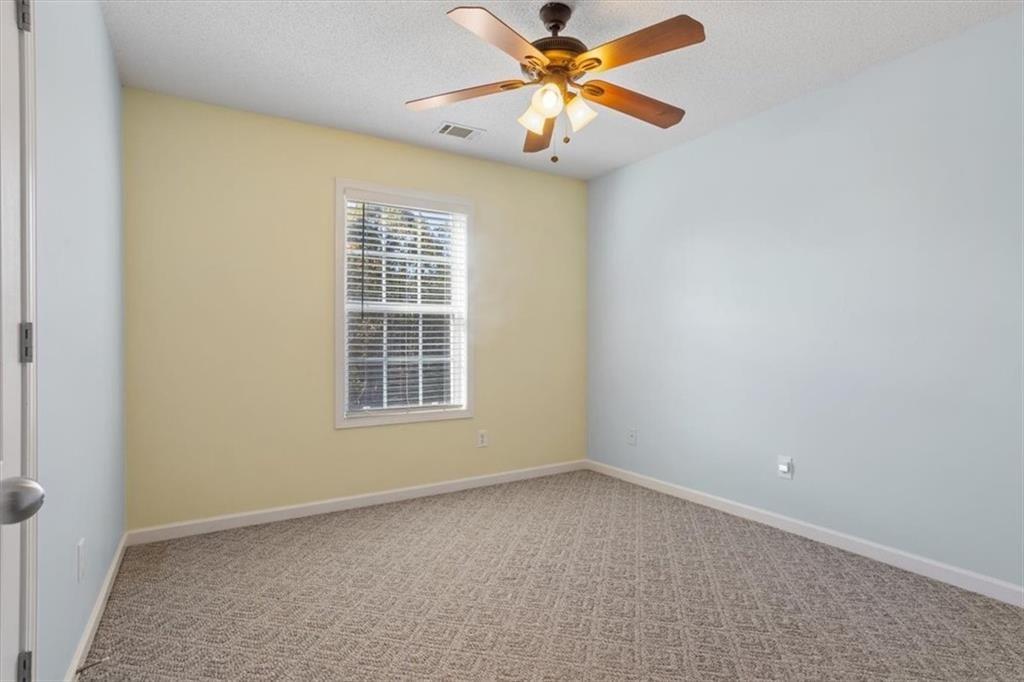 12 Moorings Run Jasper, GA 30143 - Photo 24 of 54 an empty room with a window and a fan
