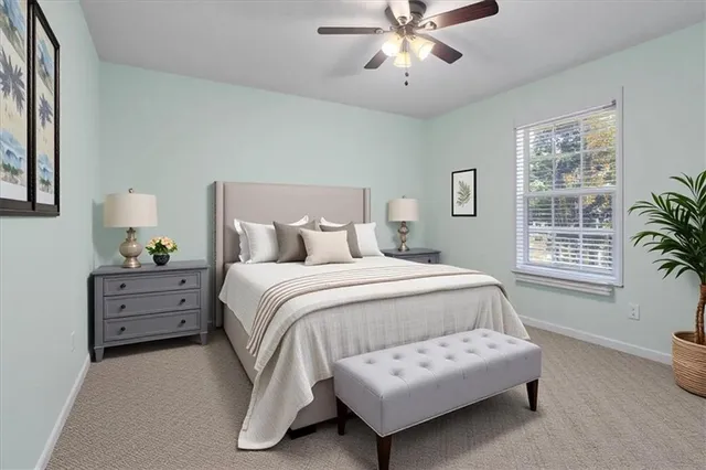 a bathroom with a granite countertop toilet a sink and a mirror