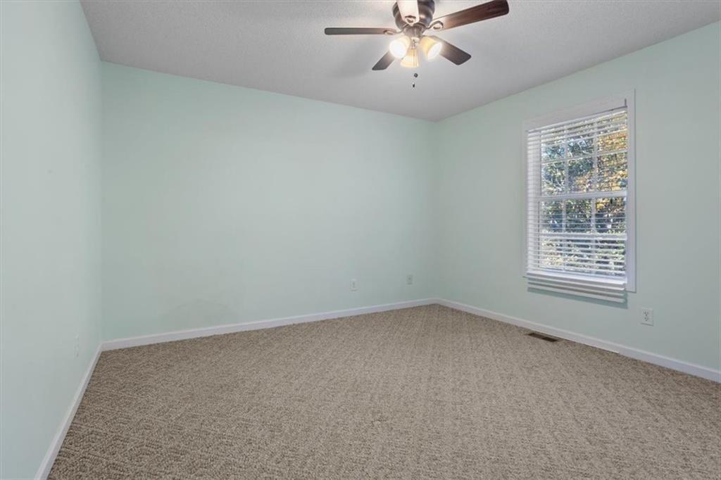 12 Moorings Run Jasper, GA 30143 - Photo 34 of 54 an empty room with a window and a fan