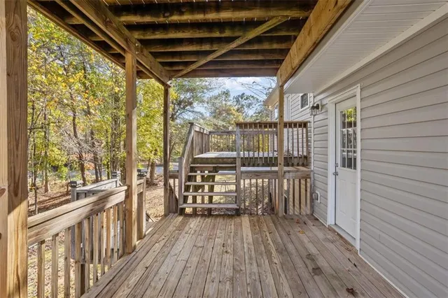 a view of balcony with wooden floor