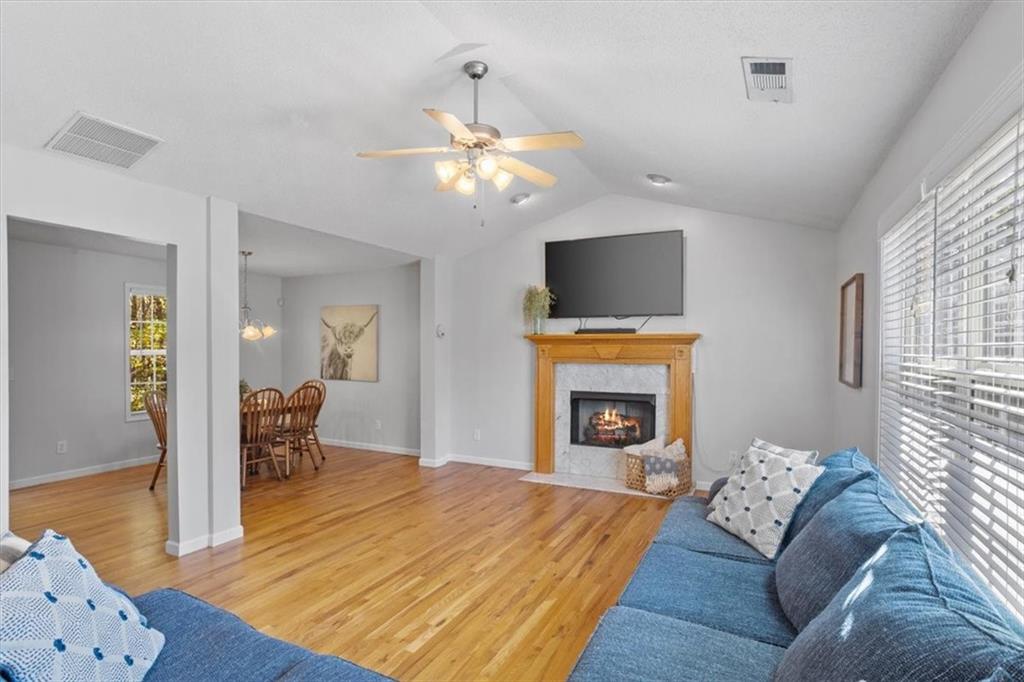 12 Moorings Run Jasper, GA 30143 - Photo 6 of 54 a living room with furniture a fireplace and a flat screen tv