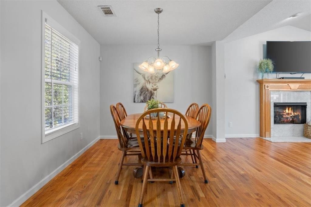 12 Moorings Run Jasper, GA 30143 - Photo 10 of 54 a dining room with furniture a chandelier and wooden floor
