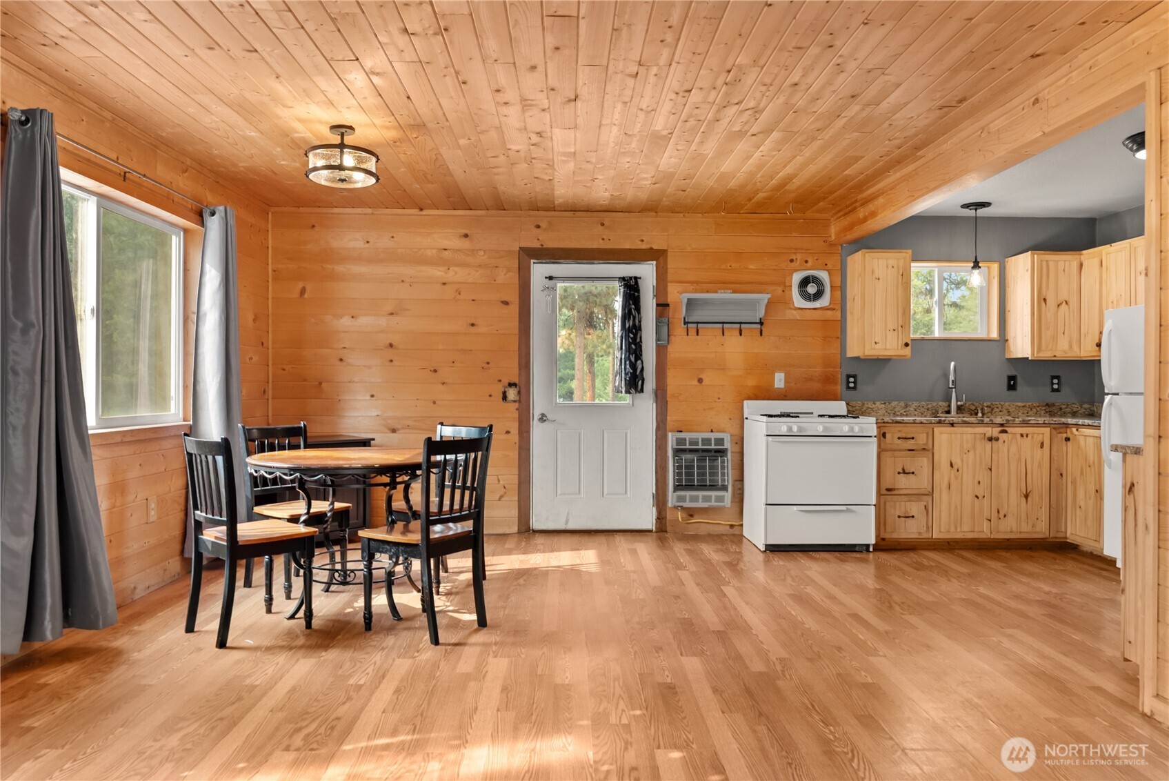 56 Ruby Two Moons Road Tonasket, WA 98855 - Photo 16 of 40 a view of a kitchen with furniture and windows