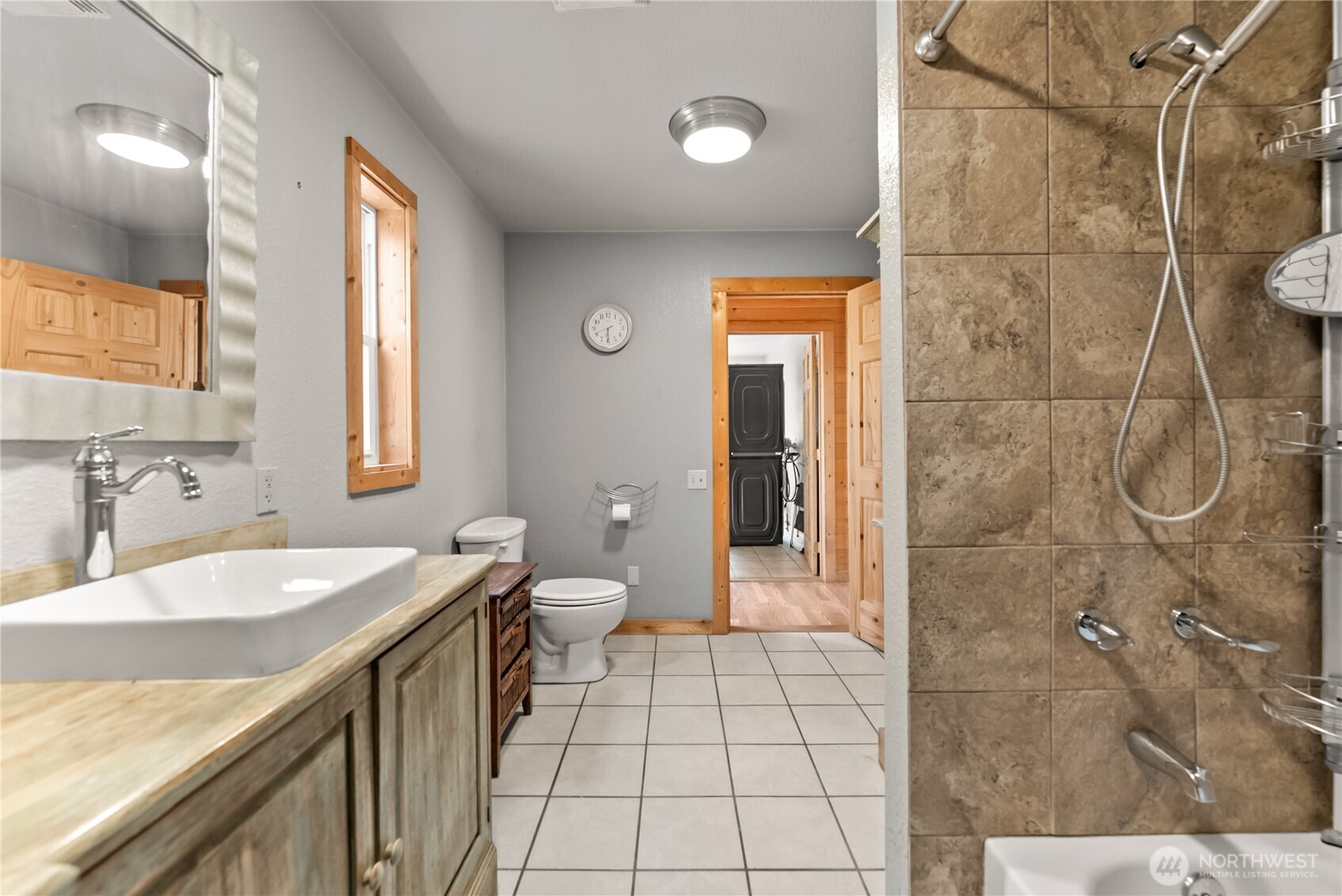 56 Ruby Two Moons Road Tonasket, WA 98855 - Photo 23 of 40 a spacious bathroom with a granite countertop sink a toilet and shower