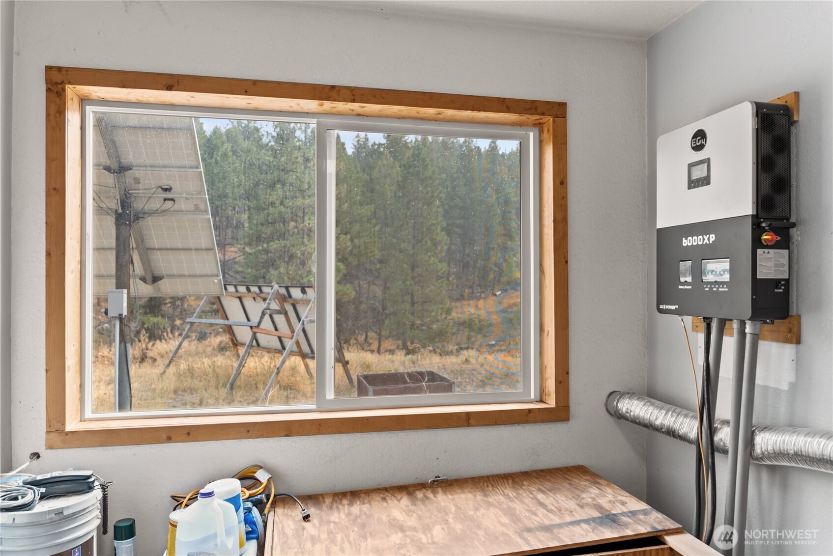 56 Ruby Two Moons Road Tonasket, WA 98855 - Photo 25 of 40 a view of a room that has a bed and a window