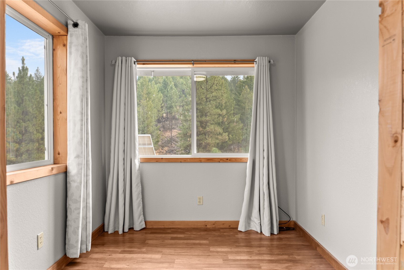 56 Ruby Two Moons Road Tonasket, WA 98855 - Photo 36 of 40 a view of a livingroom with wooden floor and a window
