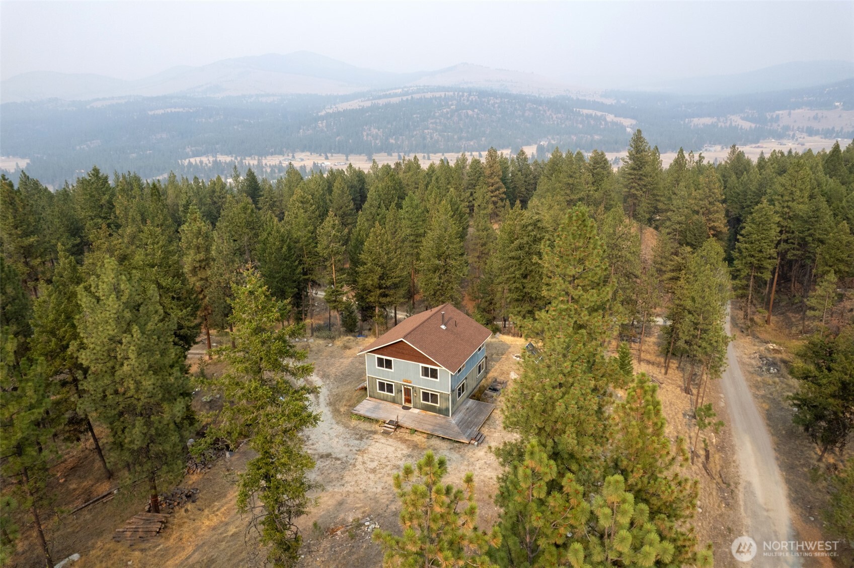 56 Ruby Two Moons Road Tonasket, WA 98855 - Photo 9 of 40 an aerial view of a house with a yard