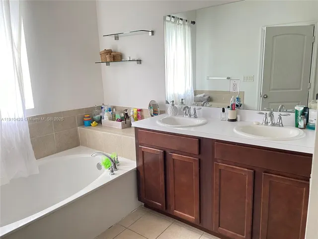 a bathroom with a sink and a bathtub