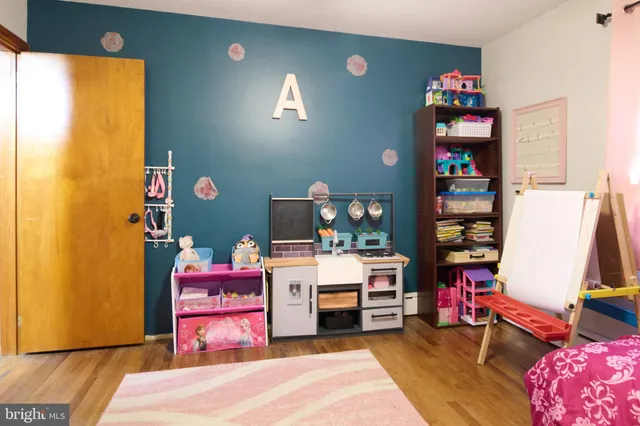 a bed room with a bed and a television