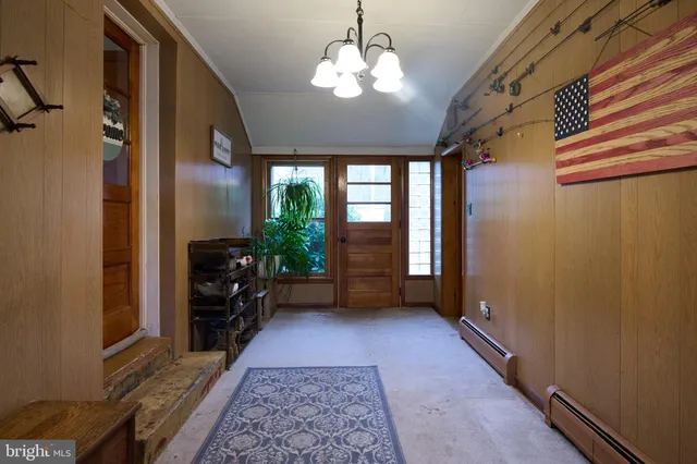 a room with furniture and a potted plant
