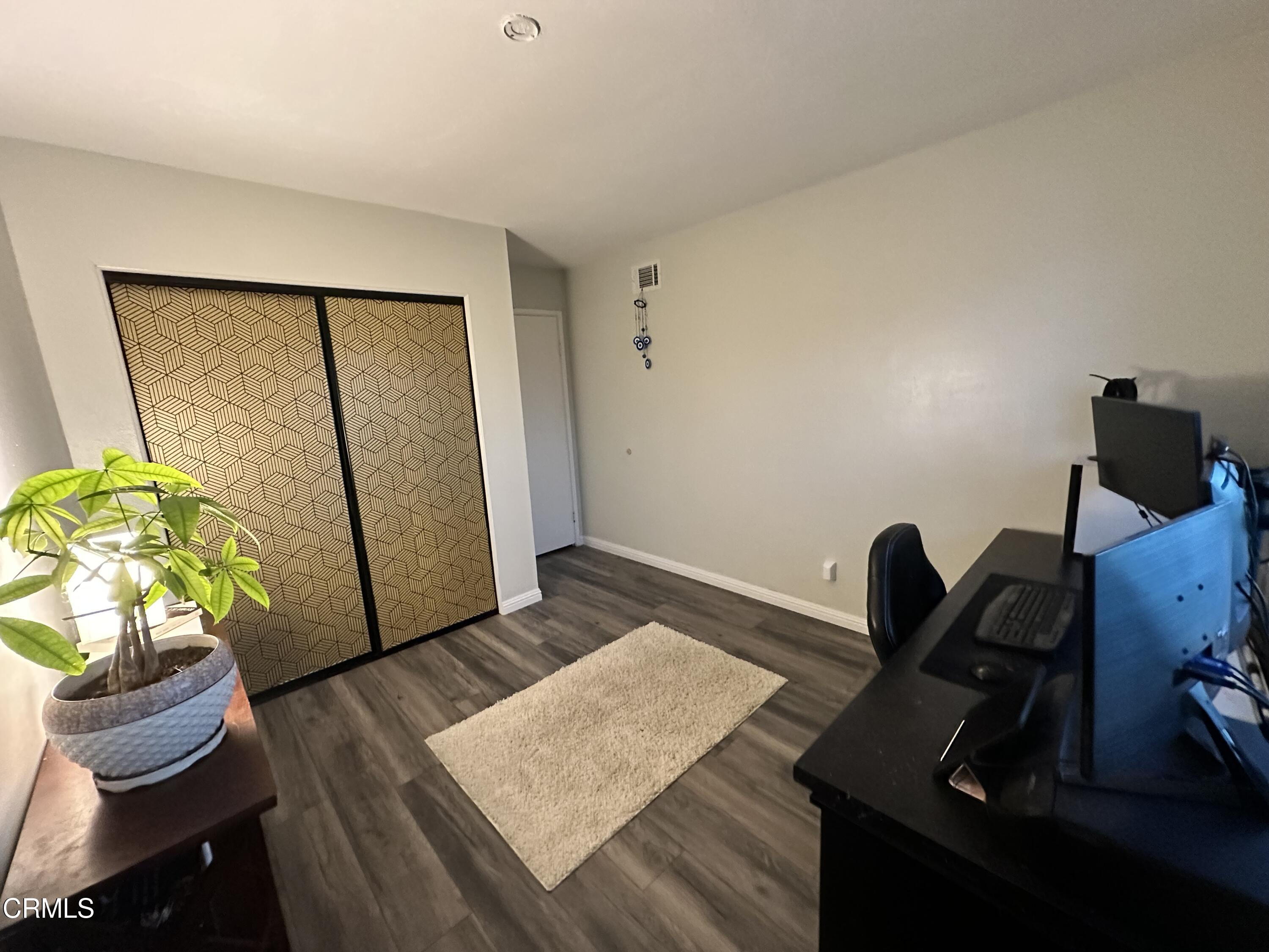 9926 Mission Vega Road, Unit 4 Santee, CA 92071 - Photo 18 of 22 a view of workspace with wooden floor windows