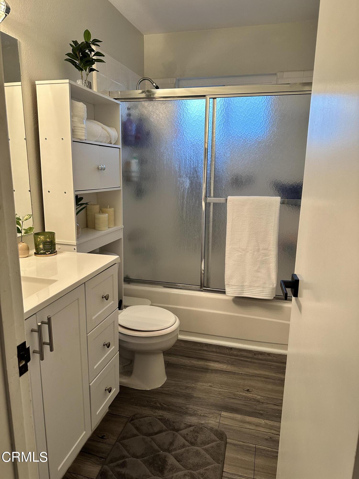 9926 Mission Vega Road, Unit 4 Santee, CA 92071 - Photo 20 of 22 a bathroom with a sink toilet and shower