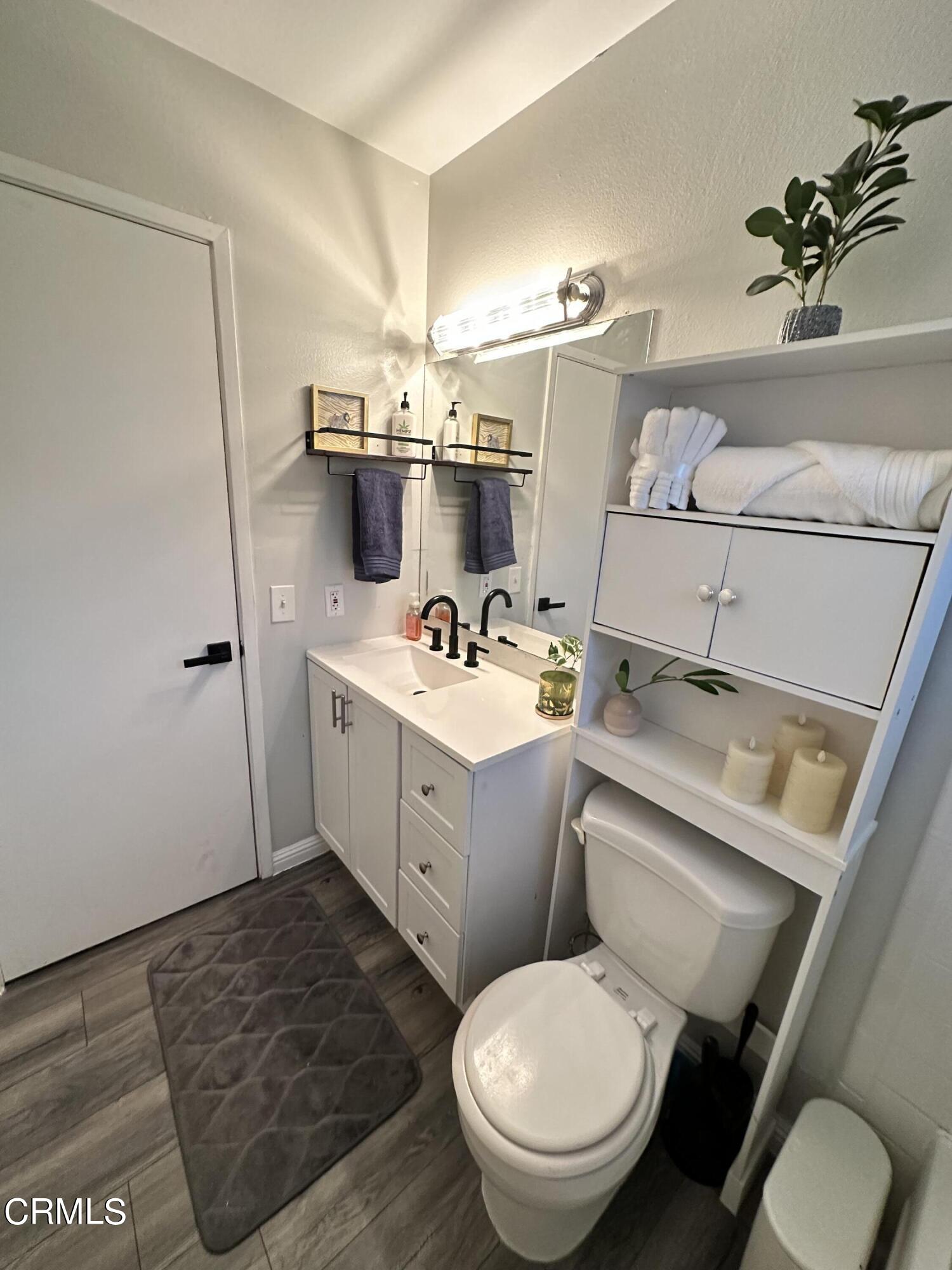 9926 Mission Vega Road, Unit 4 Santee, CA 92071 - Photo 21 of 22 a bathroom with a sink toilet and shower