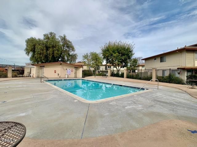 9926 Mission Vega Road, Unit 4 Santee, CA 92071 - Photo 22 of 22 a view of a house with a yard and a garage