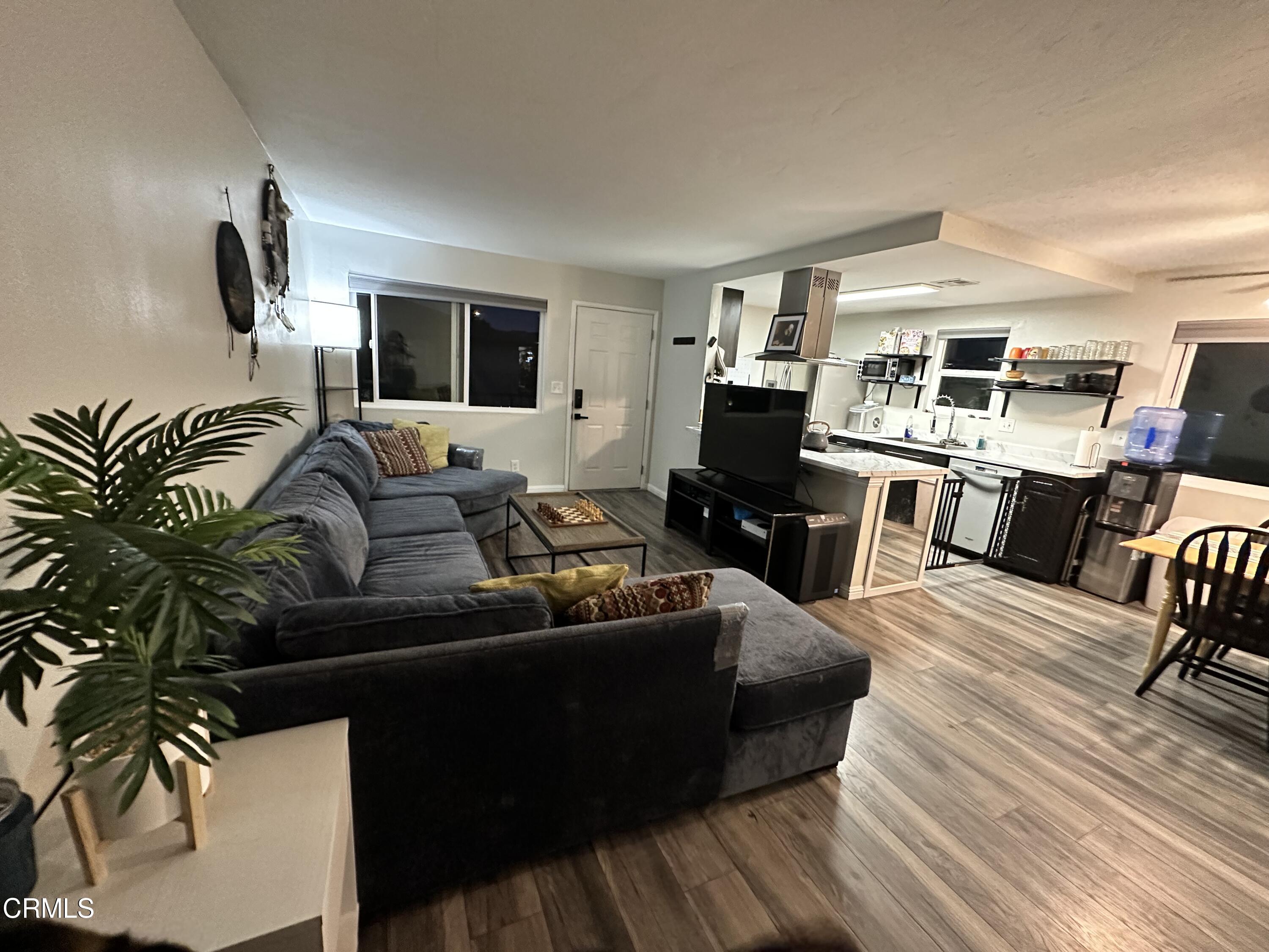 9926 Mission Vega Road, Unit 4 Santee, CA 92071 - Photo 4 of 22 a living room with furniture and a flat screen tv