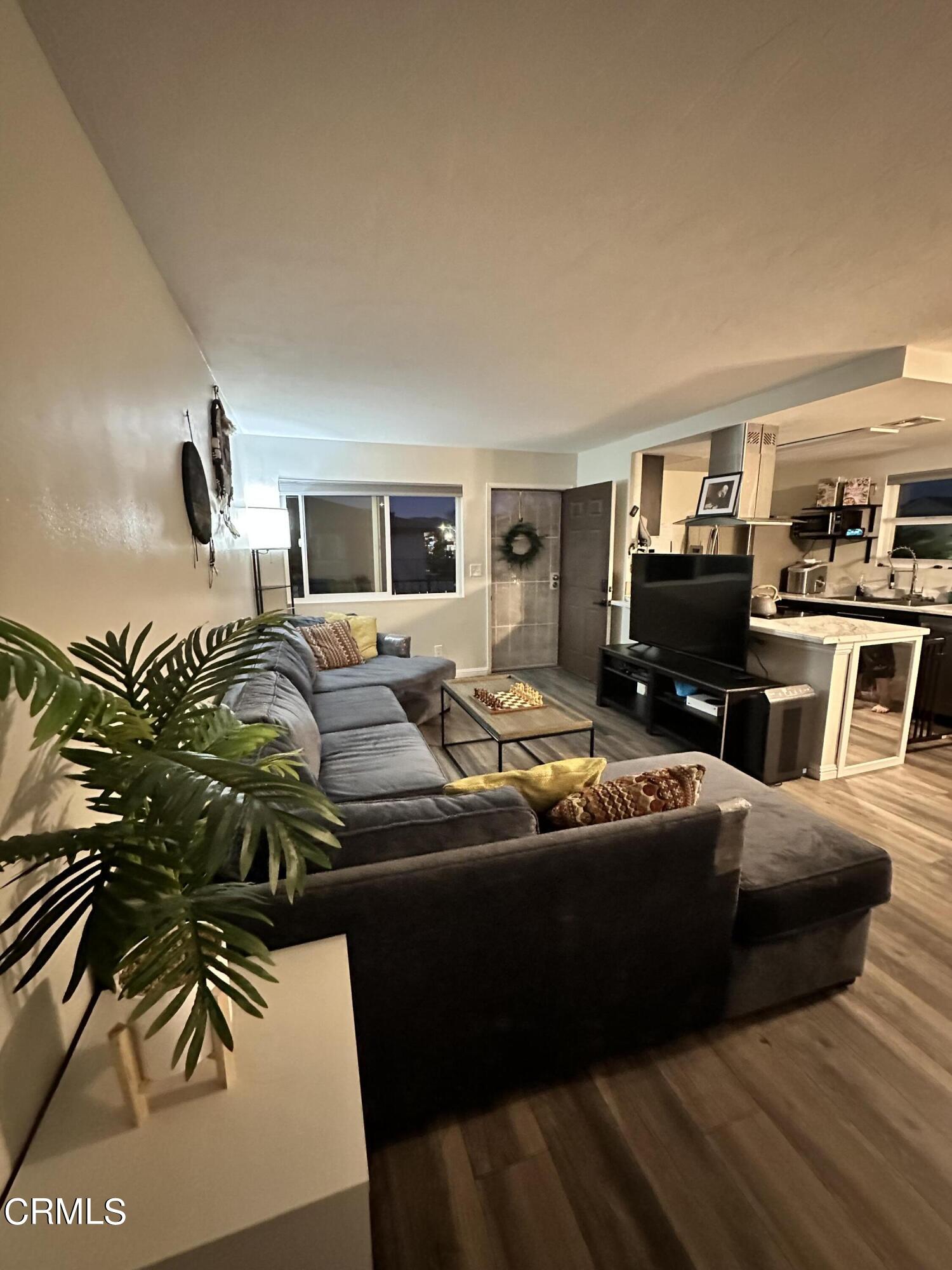 9926 Mission Vega Road, Unit 4 Santee, CA 92071 - Photo 5 of 22 a living room with furniture and a flat screen tv