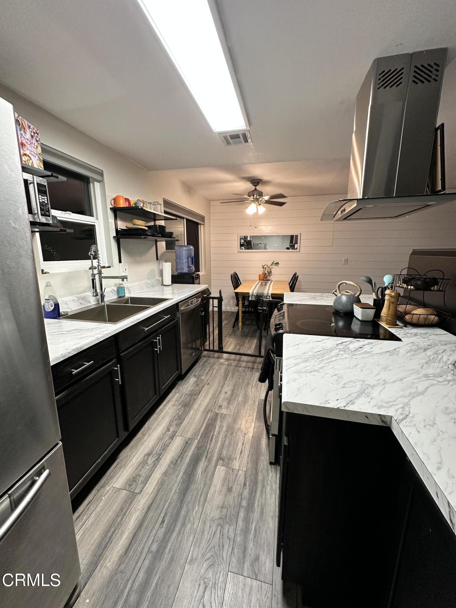 9926 Mission Vega Road, Unit 4 Santee, CA 92071 - Photo 10 of 22 a kitchen with lots of counter top space and appliances