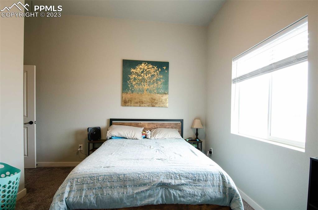 16750 Rabbit Track Trail Colorado Springs, CO 80930 - Photo 20 of 50 a bedroom with a bed and window