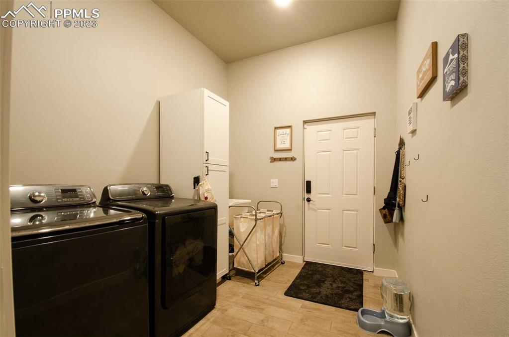 16750 Rabbit Track Trail Colorado Springs, CO 80930 - Photo 21 of 50 a bathroom with a granite countertop sink a toilet and shower