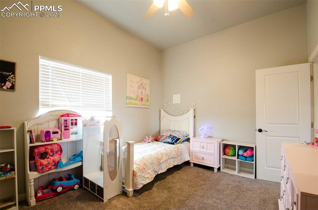 16750 Rabbit Track Trail Colorado Springs, CO 80930 - Photo 23 of 50 a bedroom with a bed and a window