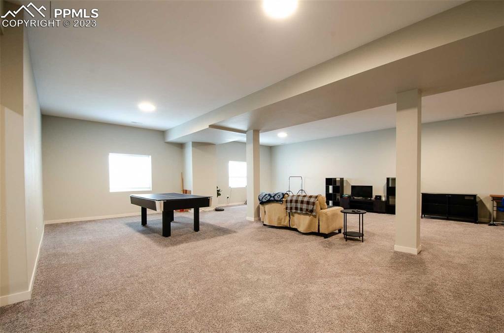 16750 Rabbit Track Trail Colorado Springs, CO 80930 - Photo 26 of 50 a view of a room with furniture and a table