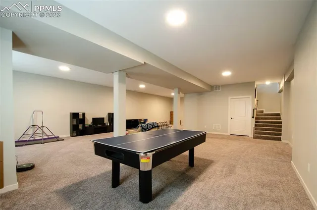 a room with furniture and a rug