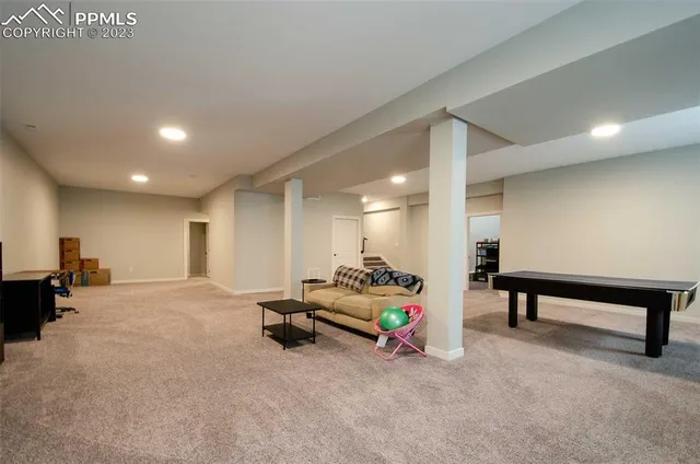 a living room with furniture and a table
